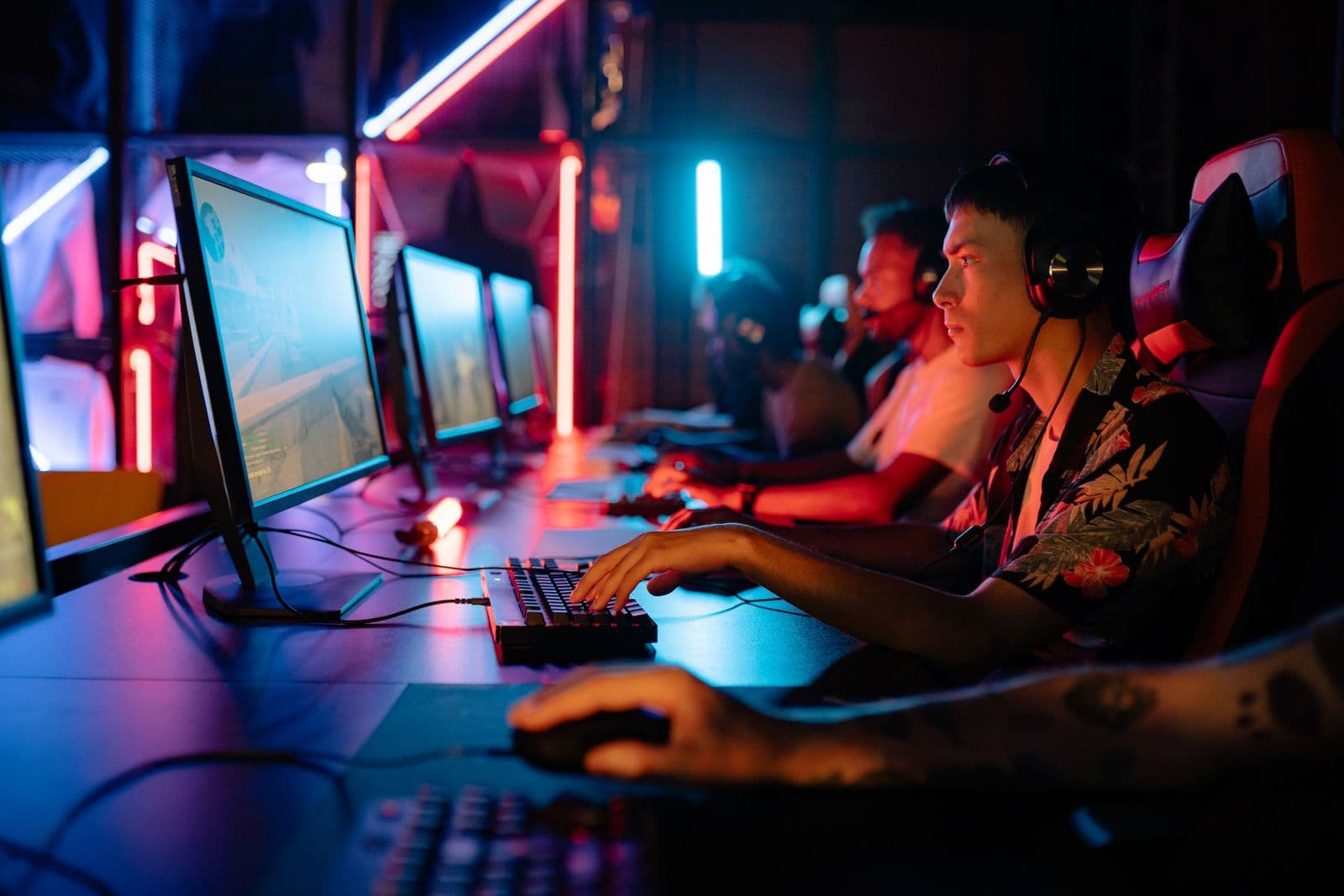 Esports players compete under neon light in a cyber arena